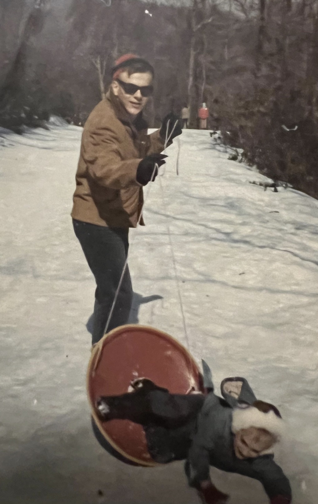 My dad and brother, sledding 1970. 